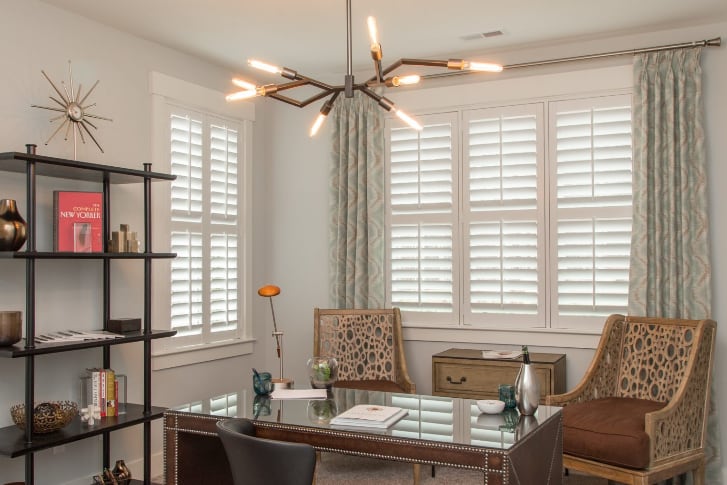 White plantation shutters in office room